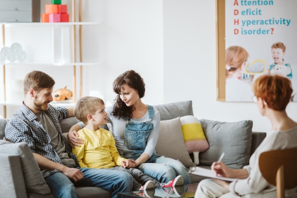 Family with child speaking with an assessor — ADHD and autism evaluations at Minnesota Mental Health Clinics
